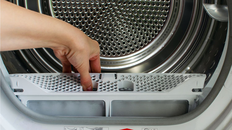 Woman clean dryer lint trap